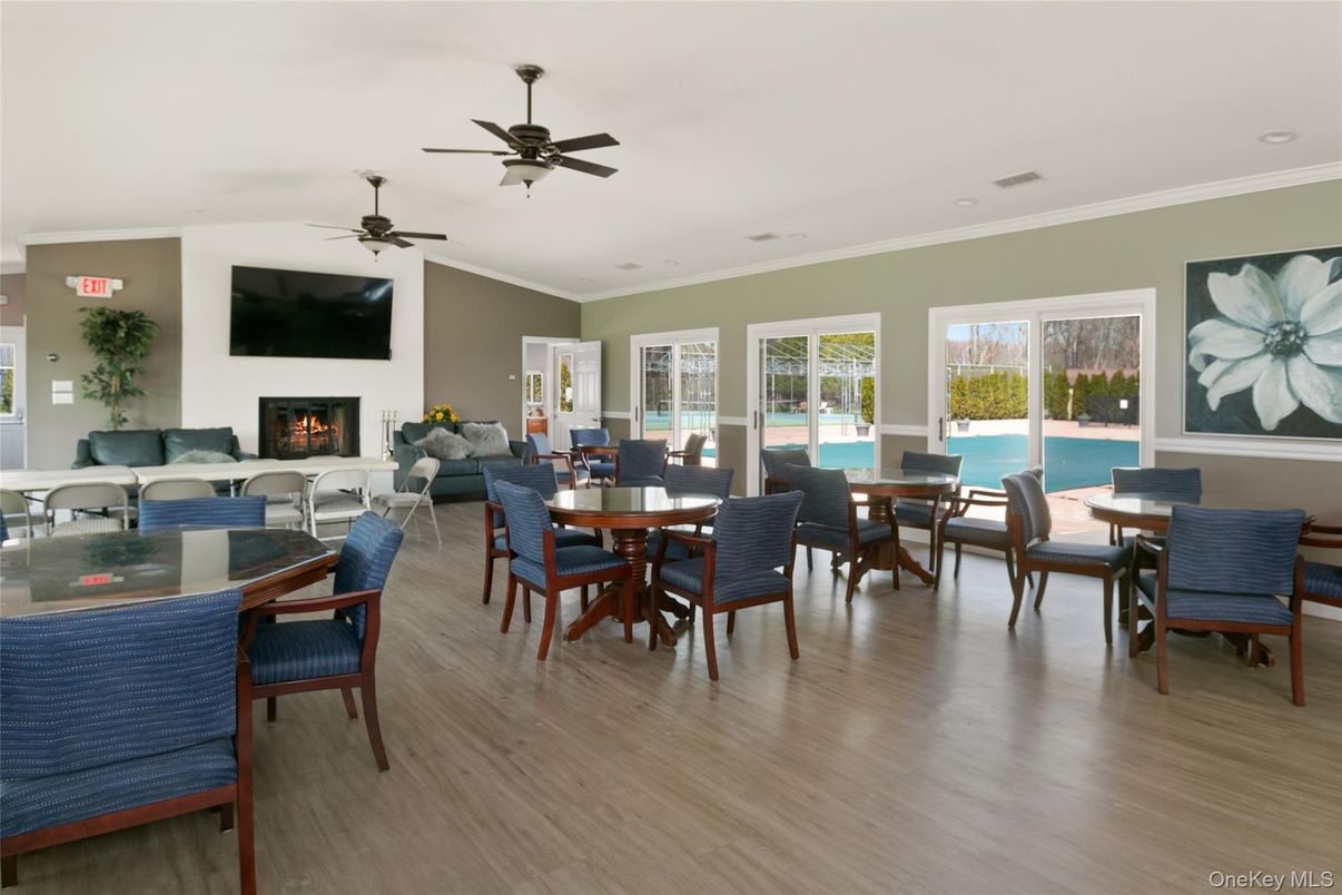 Dining room, Fireplace, Interior, Living room, Recessed Lighting, Wood Texture Flooring