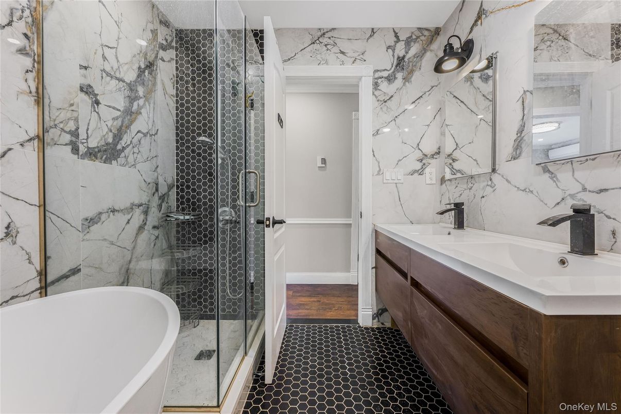 Bathroom, Dual Sink Vanities, Free Standing Baths, Glass Shower, Interior, Marble Walls, Wood Texture Flooring