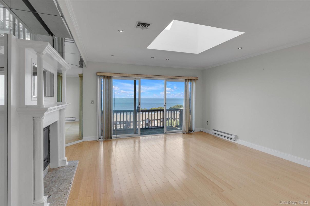 Empty room, Fireplace, Interior, Recessed Lighting, Water, Wood Texture Flooring