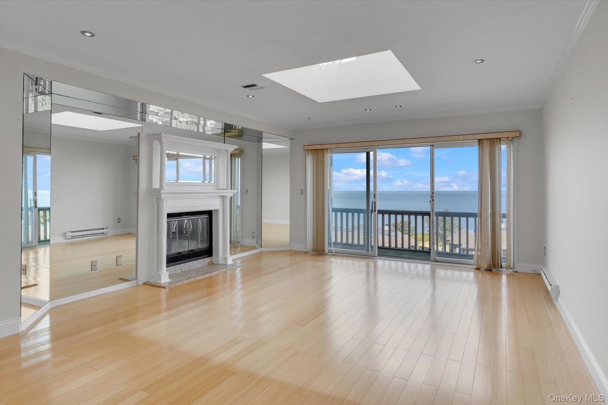 Empty room, Fireplace, Interior, Recessed Lighting, Water, Wood Texture Flooring