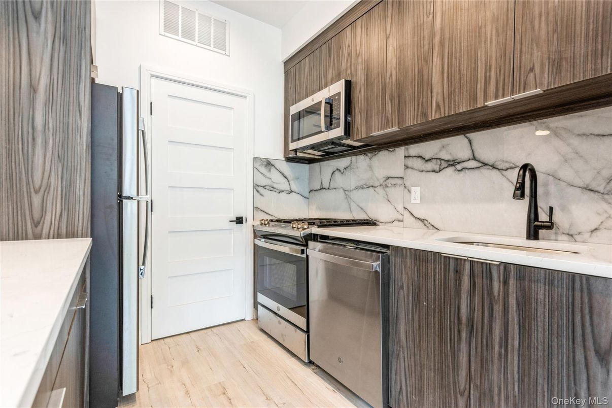 Interior, Kitchen, Marble Walls, Stainless Steel Appliances, Wood Texture Flooring