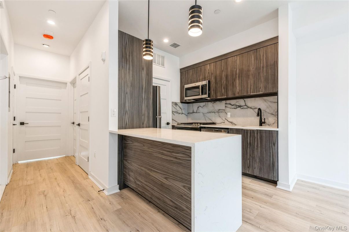 Interior, Kitchen, Marble Walls, Pendant Lights, Recessed Lighting, Wood Texture Flooring
