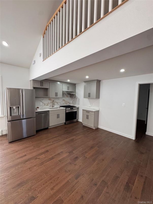 Interior, Kitchen, Marble Walls, Recessed Lighting, Stainless Steel Appliances, Wood Texture Flooring