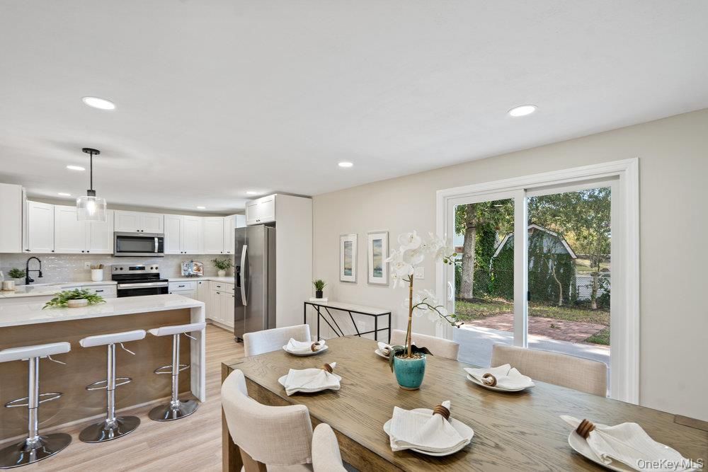 Dining room, Interior, Kitchen, Pendant Lights, Recessed Lighting, Stainless Steel Appliances, Wood Texture Flooring