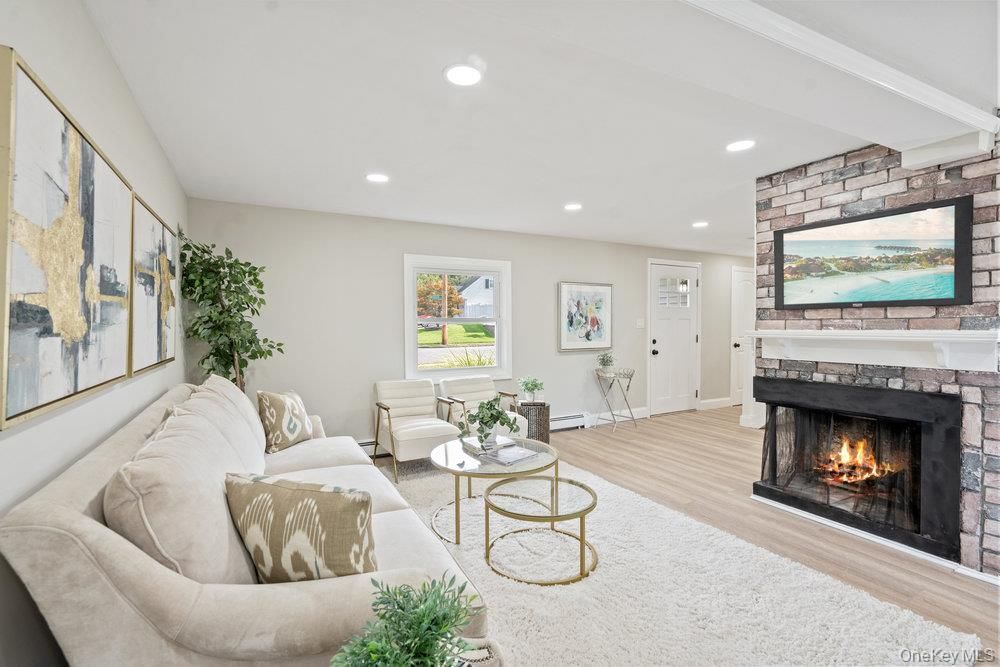 Fireplace, Interior, Living room, Recessed Lighting, Stone Walls, Wood Texture Flooring