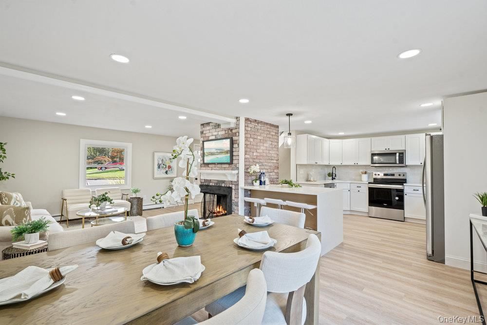 Dining room, Fireplace, Interior, Kitchen, Living room, Pendant Lights, Recessed Lighting, Stainless Steel Appliances, Stone Walls, Wood Texture Flooring