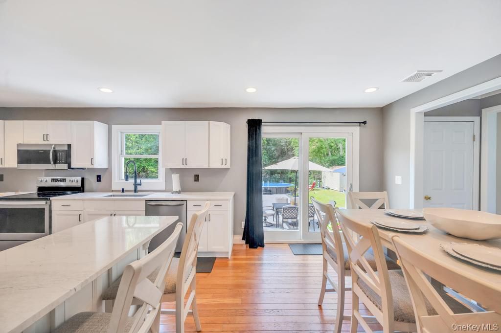 Dining room, Interior, Kitchen, Recessed Lighting, Stainless Steel Appliances, Wood Texture Flooring