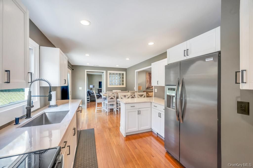 Dining room, Interior, Kitchen, Recessed Lighting, Stainless Steel Appliances, Wood Texture Flooring