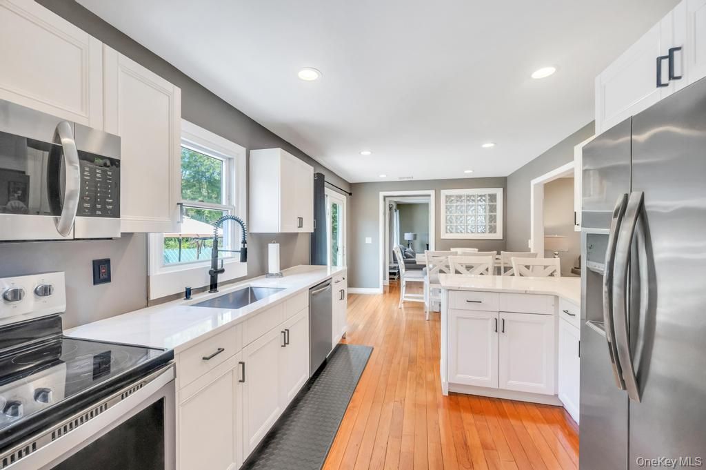 Dining room, Interior, Kitchen, Recessed Lighting, Stainless Steel Appliances, Wood Texture Flooring
