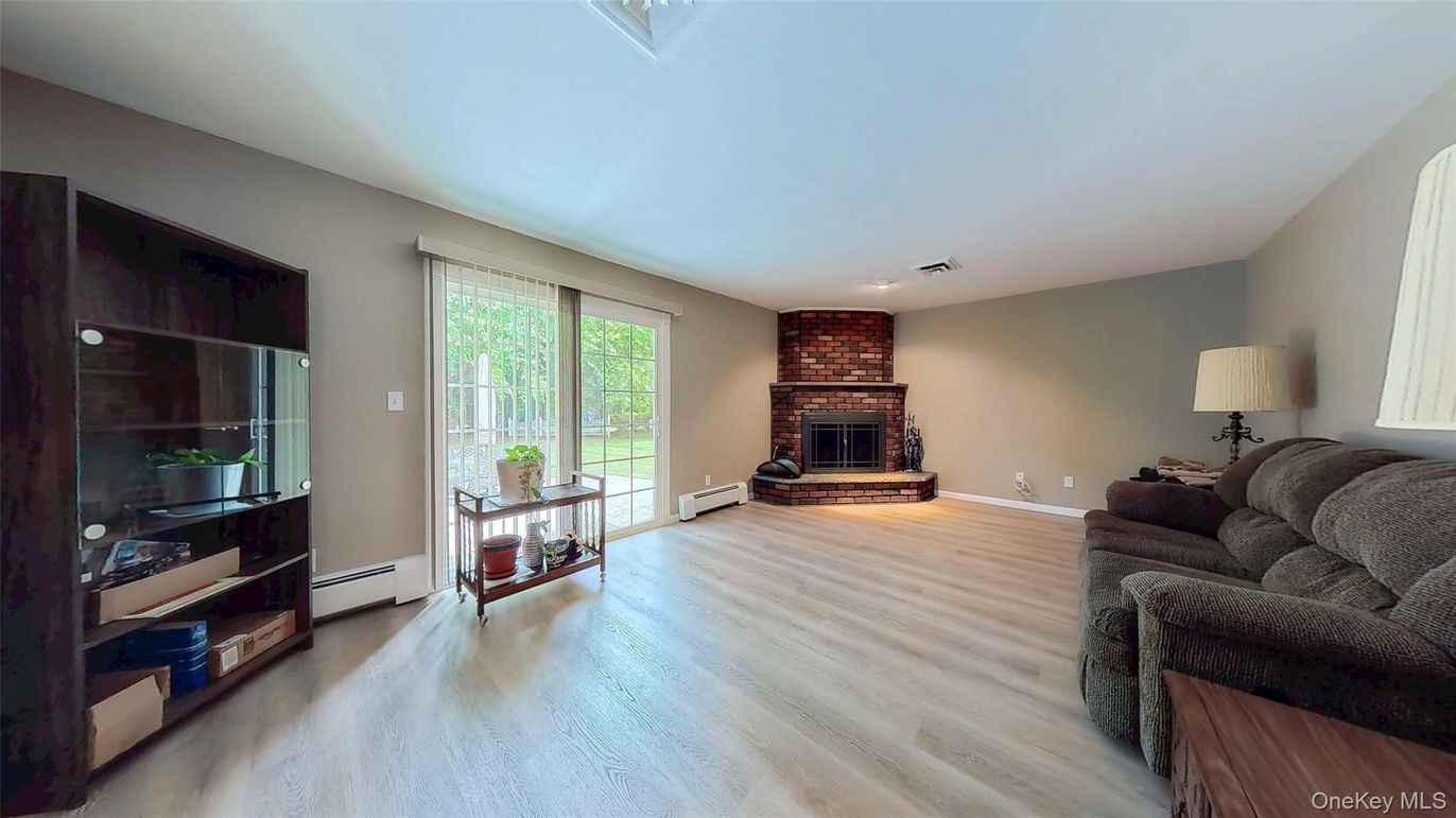 Fireplace, Interior, Living room, Recessed Lighting, Stone Walls, Wood Texture Flooring