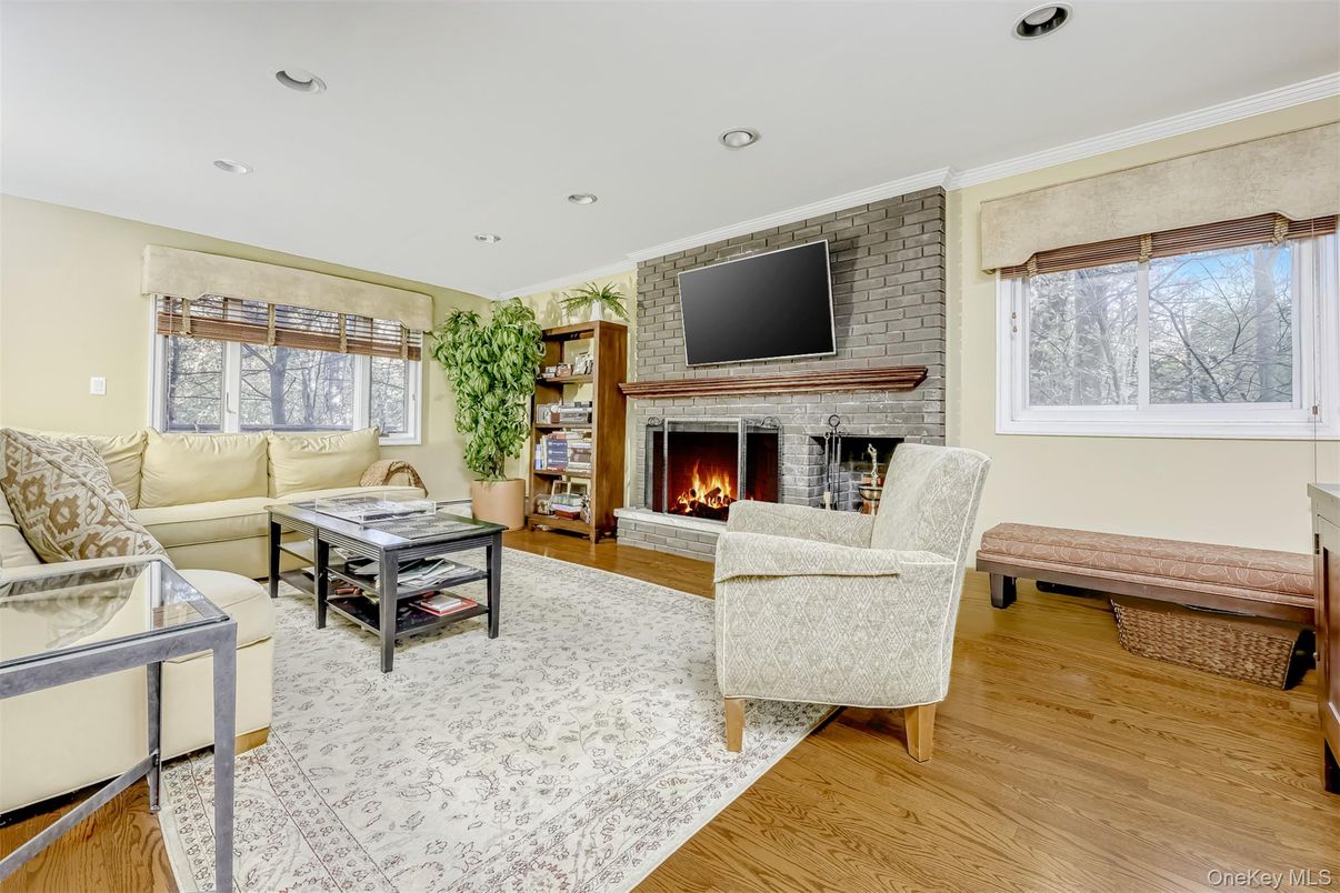 Fireplace, Interior, Living room, Recessed Lighting, Stone Walls, Wood Texture Flooring