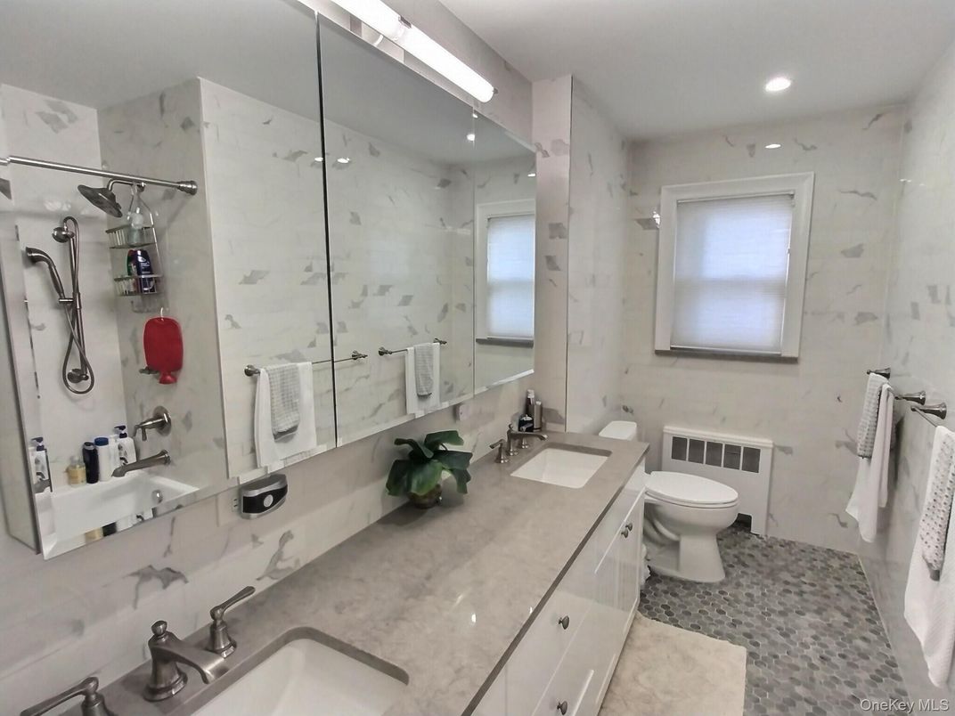 Bathroom, Dual Sink Vanities, Glass Shower, Interior, Marble Walls, Recessed Lighting