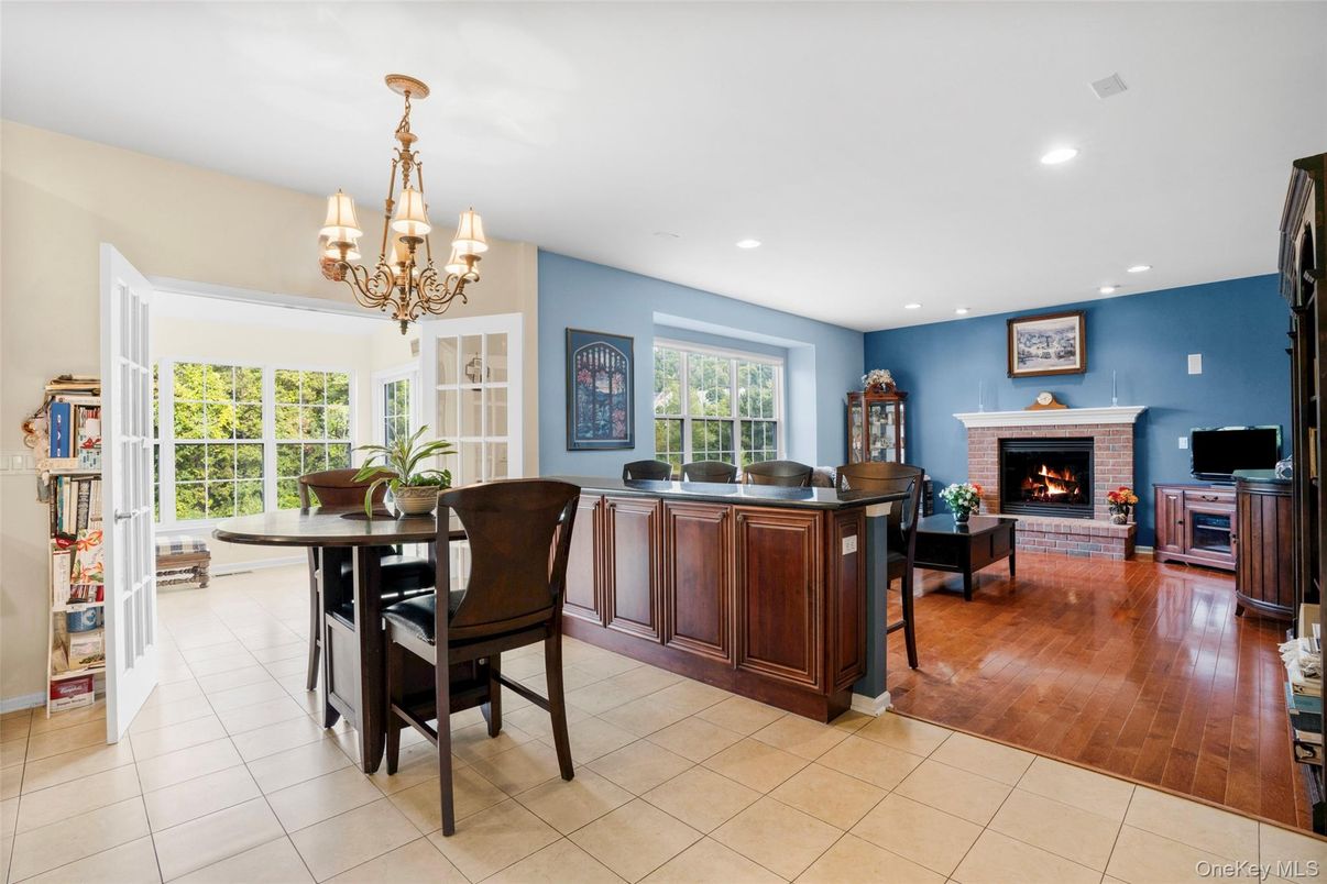 Chandelier, Dining room, Fireplace, Interior, Living room, Recessed Lighting, Wood Texture Flooring