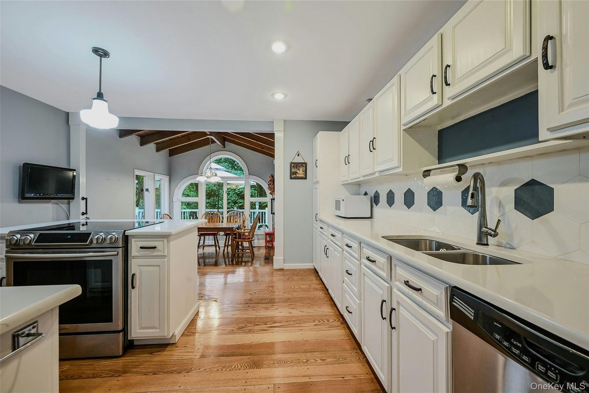 Dining room, Interior, Kitchen, Pendant Lights, Recessed Lighting, Stainless Steel Appliances, Wooden Beams, Wood Texture Flooring