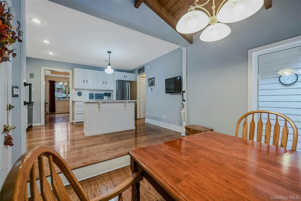 Dining room, Interior, Kitchen, Pendant Lights, Recessed Lighting, Stainless Steel Appliances, Wood Texture Flooring
