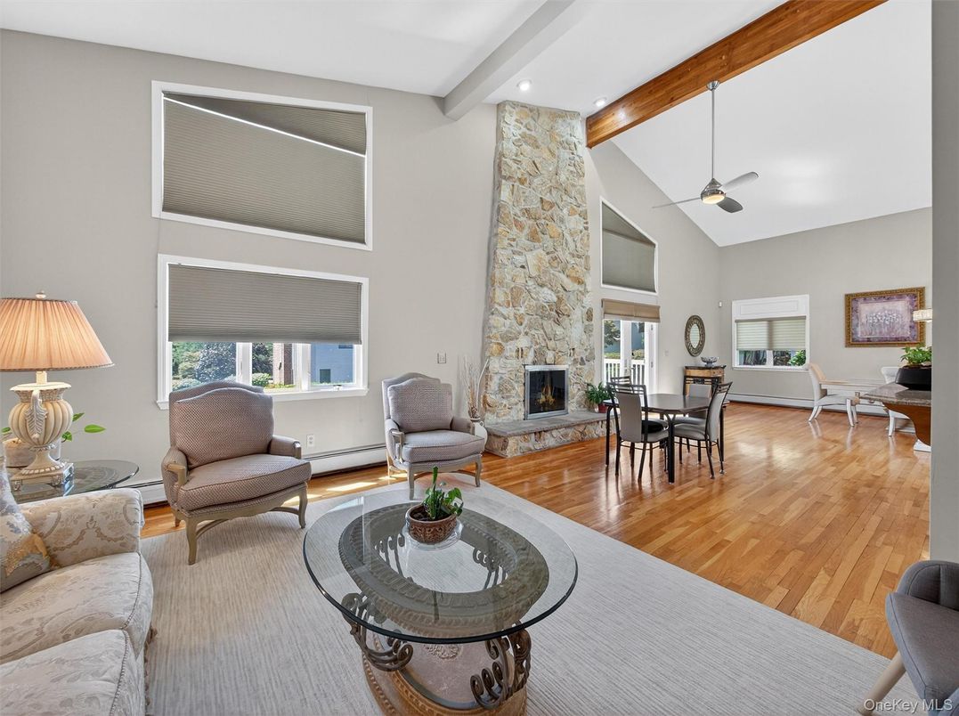 Dining room, Fireplace, Interior, Living room, Recessed Lighting, Stone Walls, Wooden Beams, Wood Texture Flooring