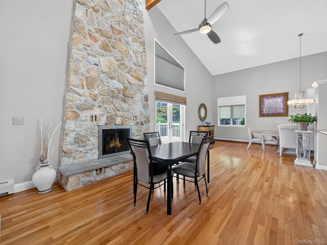 Dining room, Fireplace, Interior, Pendant Lights, Stone Walls, Wood Texture Flooring