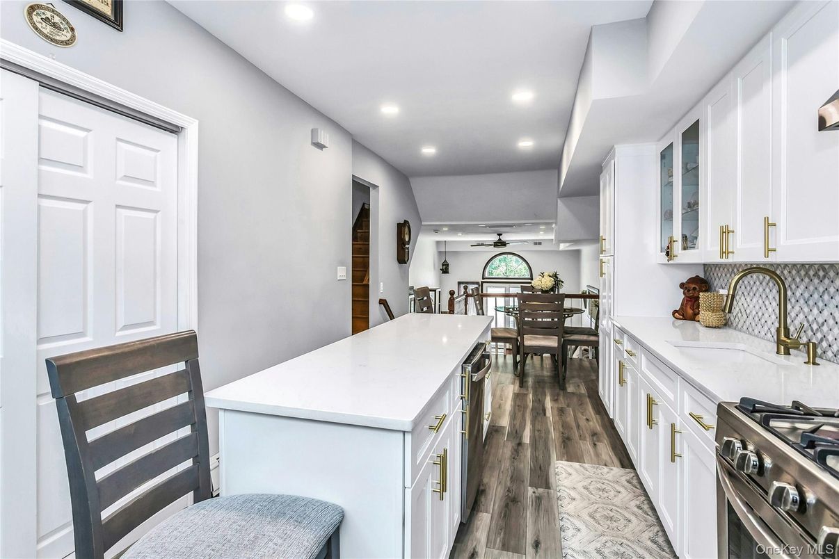 Dining room, Interior, Kitchen, Recessed Lighting, Stainless Steel Appliances, Wood Texture Flooring