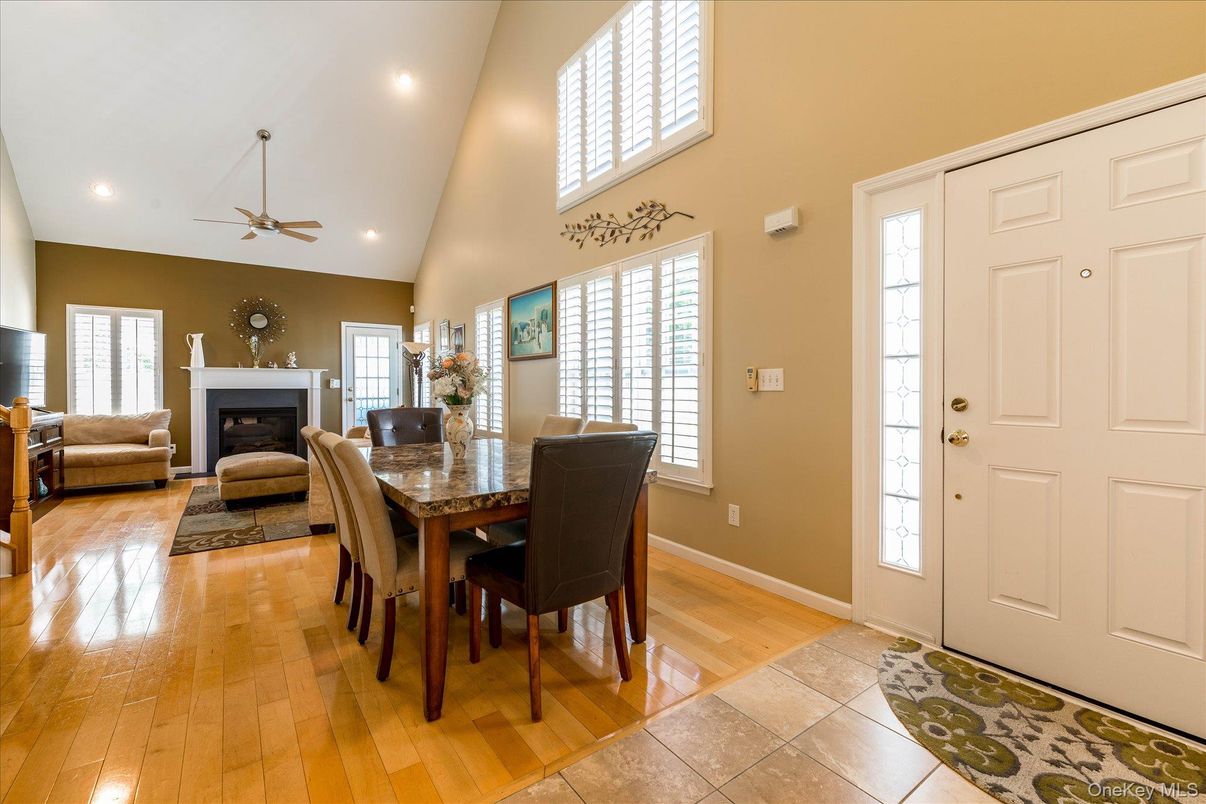 Dining room, Fireplace, Interior, Living room, Recessed Lighting, Wood Texture Flooring