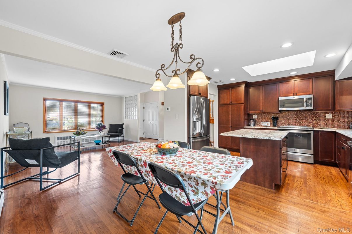 Dining room, Interior, Kitchen, Living room, Pendant Lights, Recessed Lighting, Stainless Steel Appliances, Wood Texture Flooring
