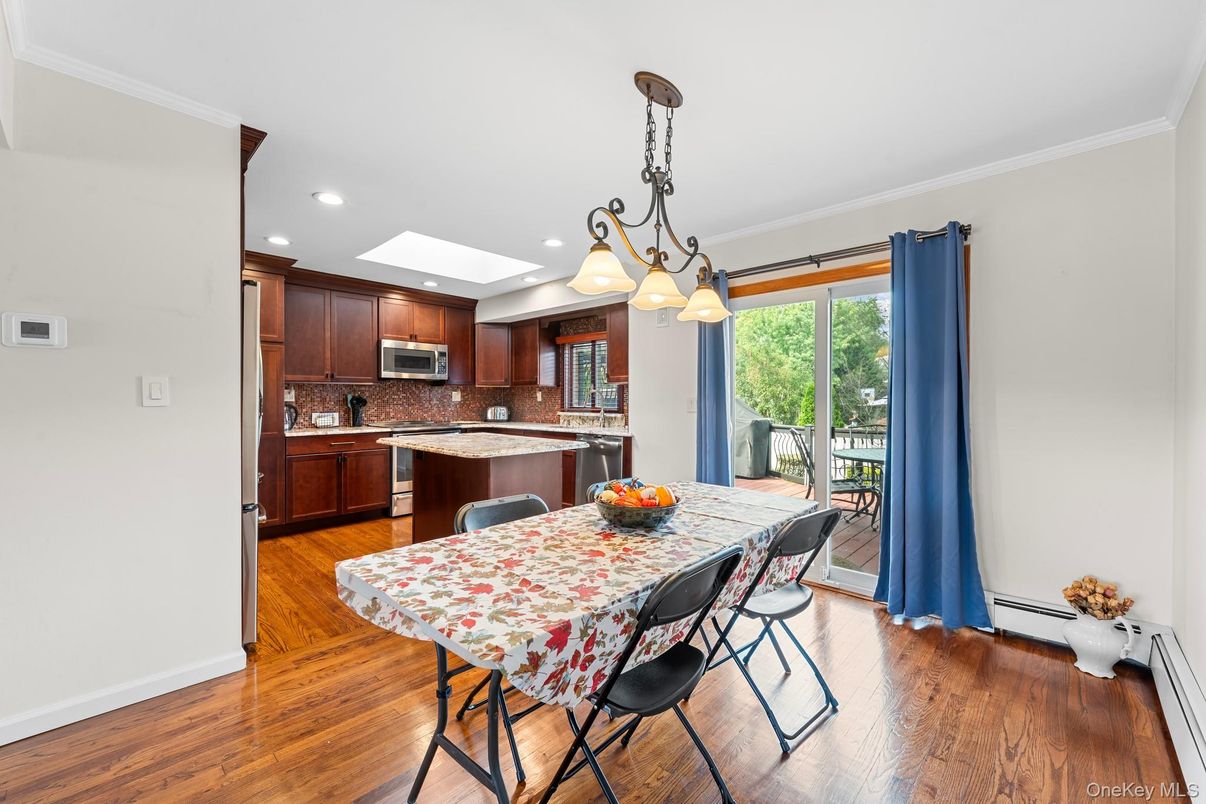 Dining room, Interior, Kitchen, Pendant Lights, Recessed Lighting, Stainless Steel Appliances, Wood Texture Flooring
