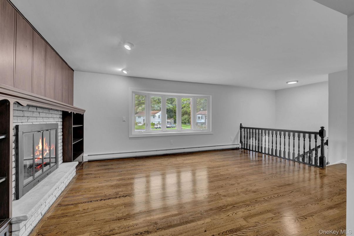 Empty room, Fireplace, Interior, Recessed Lighting, Wood Texture Flooring