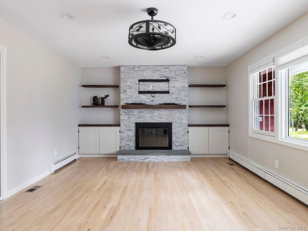 Fireplace, Interior, Recessed Lighting, Stone Walls, Wood Texture Flooring
