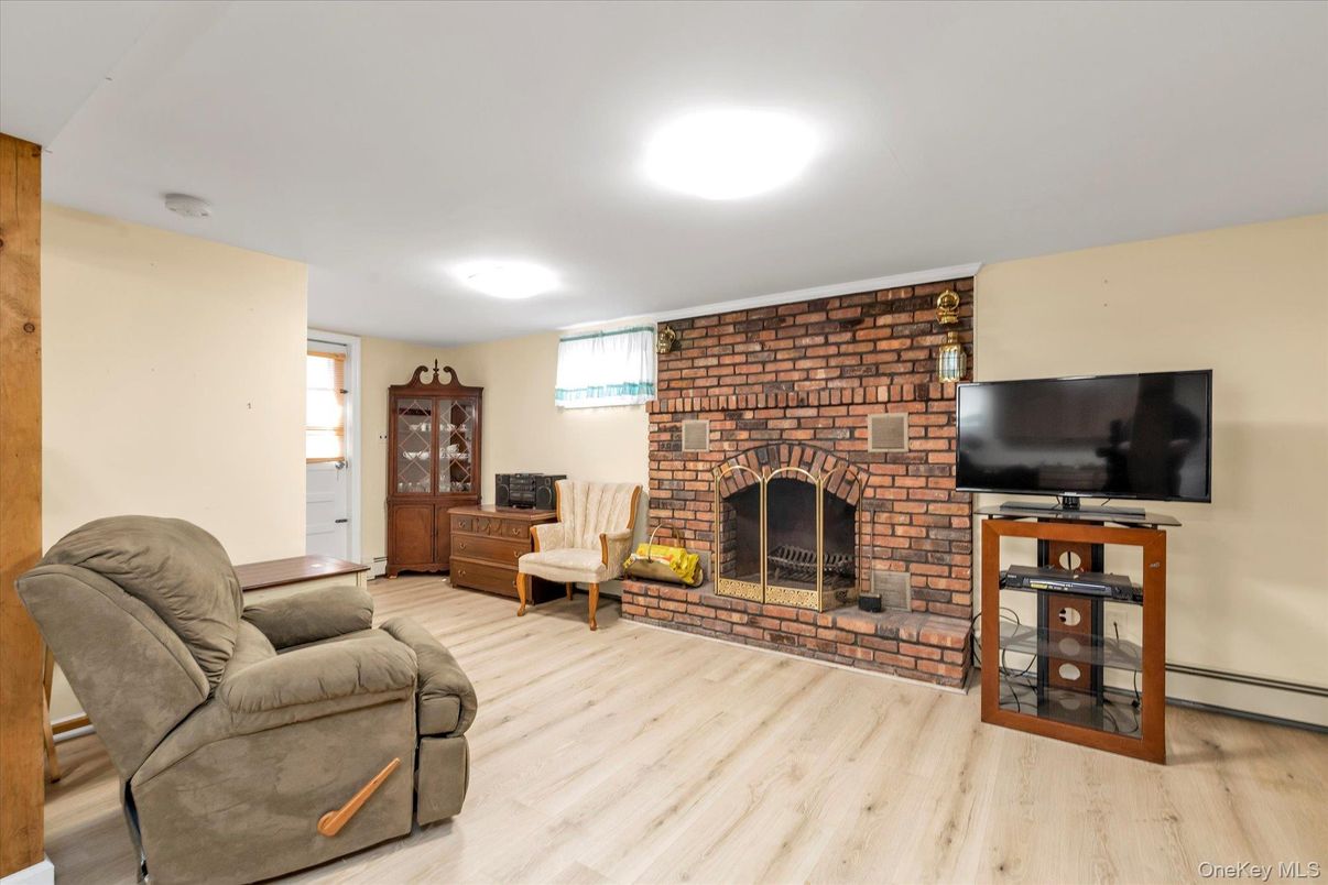 Fireplace, Interior, Living room, Recessed Lighting, Stone Walls, Wood Texture Flooring