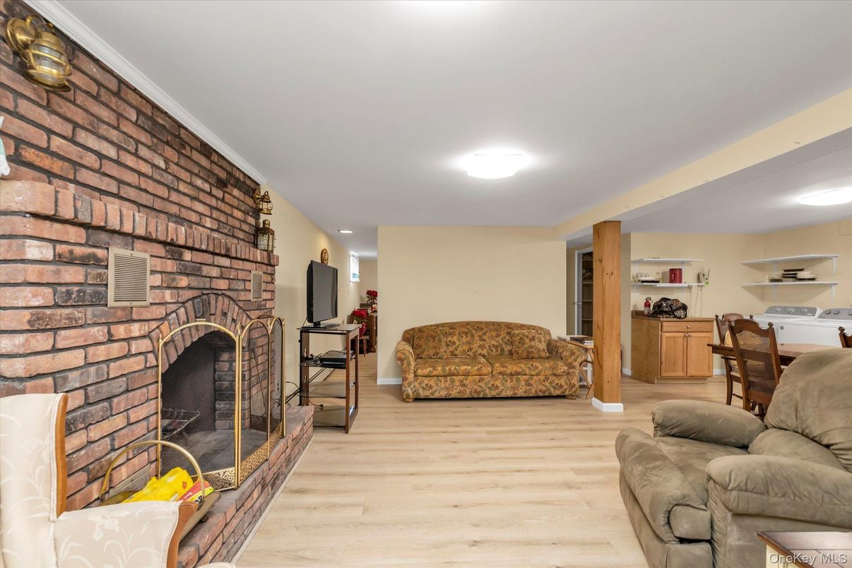 Dining room, Fireplace, Interior, Living room, Recessed Lighting, Stone Walls, Wood Texture Flooring