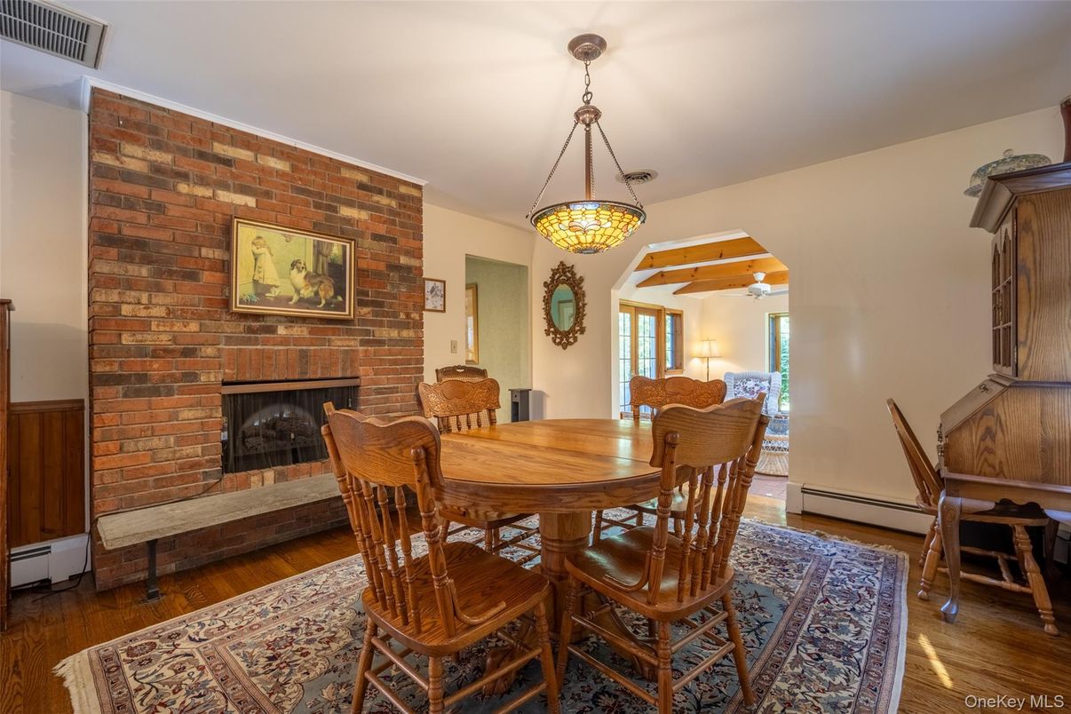 Dining room, Fireplace, Interior, Pendant Lights, Stone Walls, Wood Texture Flooring