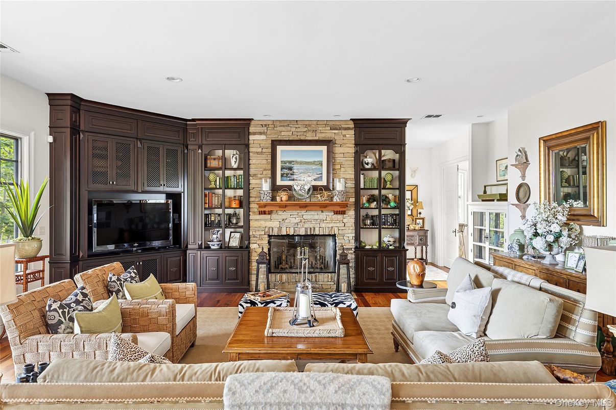 Fireplace, Interior, Living room, Recessed Lighting, Stone Walls, Wood Texture Flooring