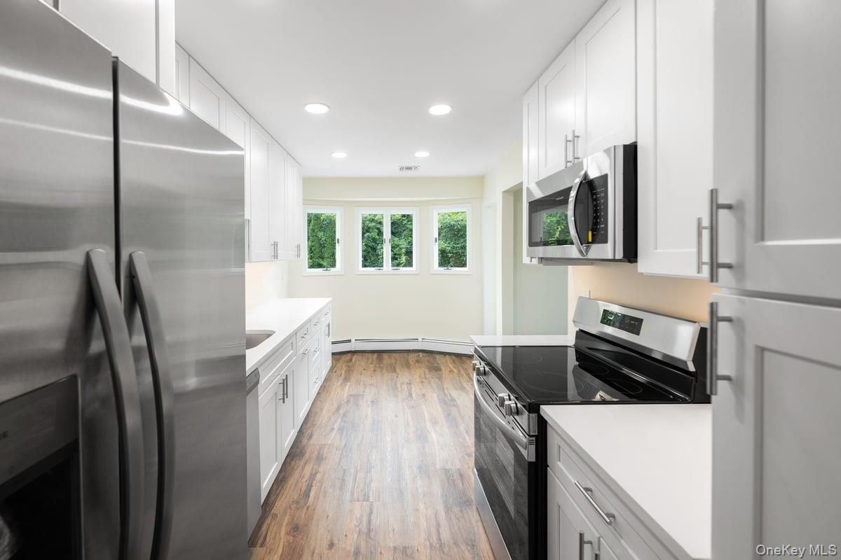 Interior, Kitchen, Recessed Lighting, Stainless Steel Appliances, Wood Texture Flooring