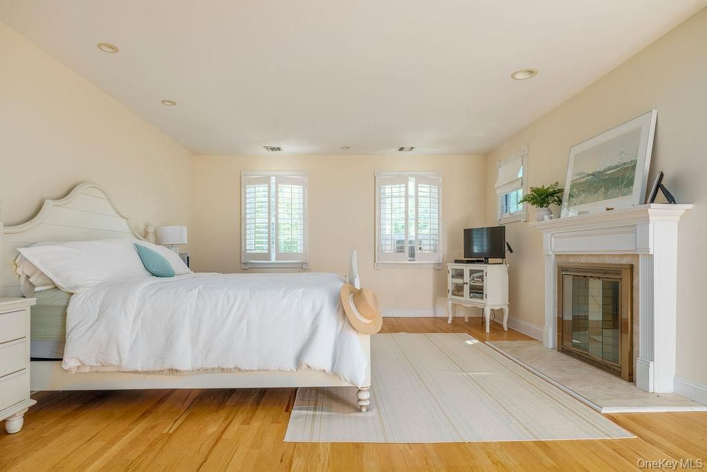 Bedroom, Fireplace, Interior, Recessed Lighting, Wood Texture Flooring