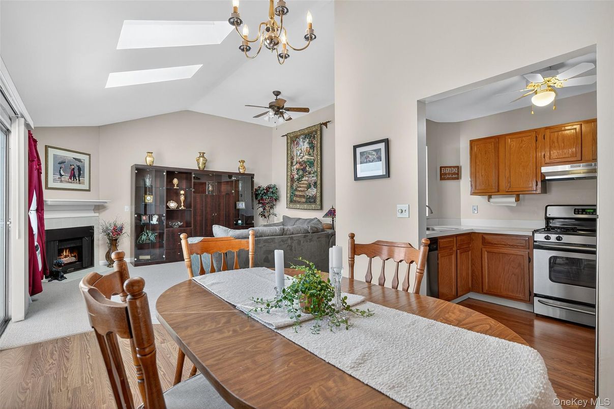Chandelier, Dining room, Fireplace, Interior, Kitchen, Wood Texture Flooring