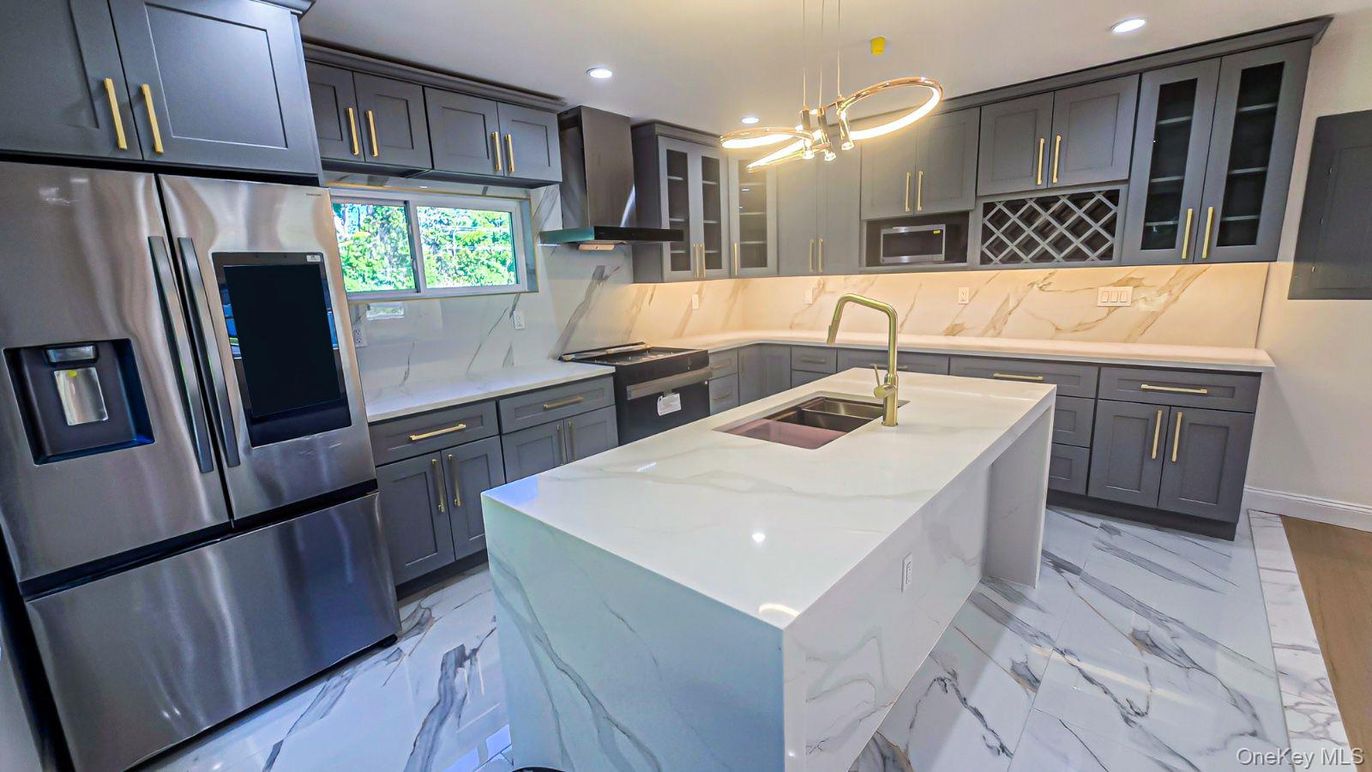 Interior, Kitchen, Marble, Marble Walls, Pendant Lights, Recessed Lighting, Stainless Steel Appliances
