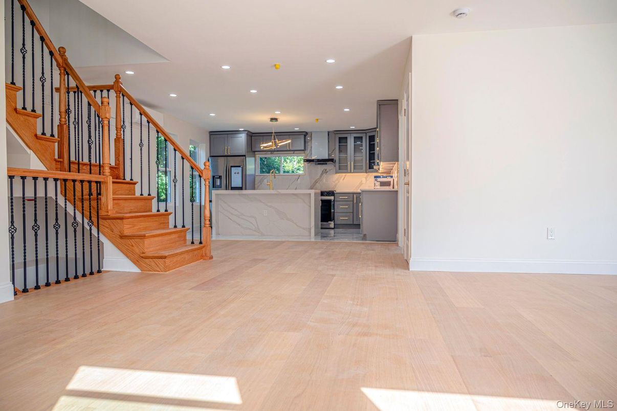 Interior, Kitchen, Marble Walls, Pendant Lights, Recessed Lighting, Stainless Steel Appliances, Wood Texture Flooring