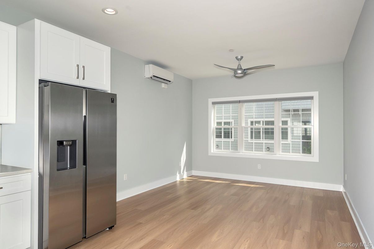 Empty room, Interior, Recessed Lighting, Stainless Steel Appliances, Wood Texture Flooring