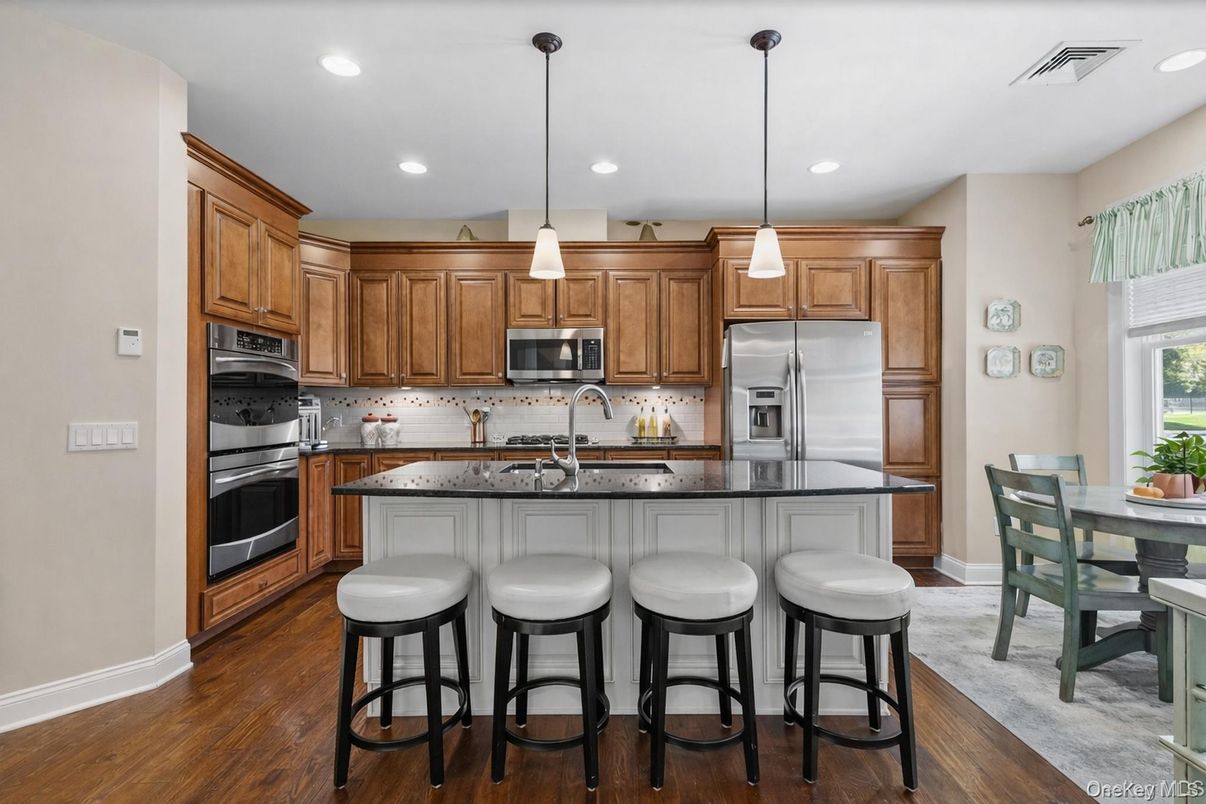 Dining room, Interior, Kitchen, Pendant Lights, Recessed Lighting, Stainless Steel Appliances, Wood Texture Flooring