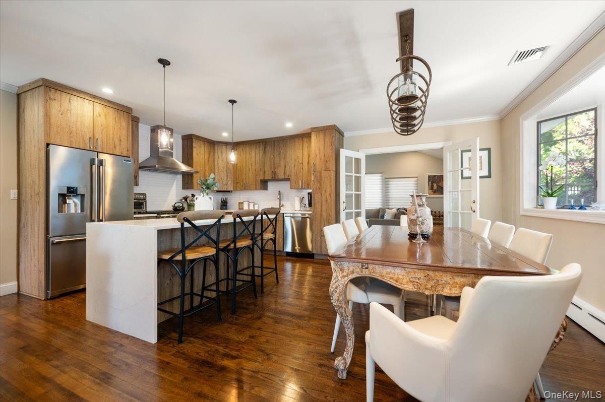 Dining room, Interior, Kitchen, Pendant Lights, Recessed Lighting, Stainless Steel Appliances, Wood Texture Flooring