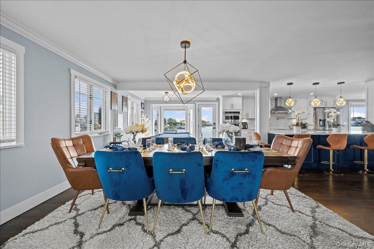 Dining room, Interior, Kitchen, Pendant Lights, Recessed Lighting, Stainless Steel Appliances, Wood Texture Flooring