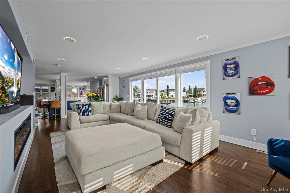 Dining room, Fireplace, Interior, Living room, Recessed Lighting, Wood Texture Flooring