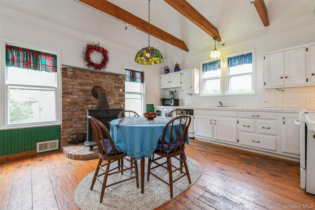 Dining room, Fireplace, Interior, Kitchen, Pendant Lights, Stone Walls, Wooden Beams, Wood Texture Flooring