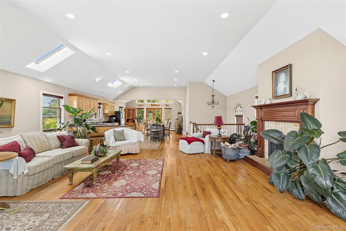 Dining room, Fireplace, Interior, Living room, Pendant Lights, Recessed Lighting, Wood Texture Flooring