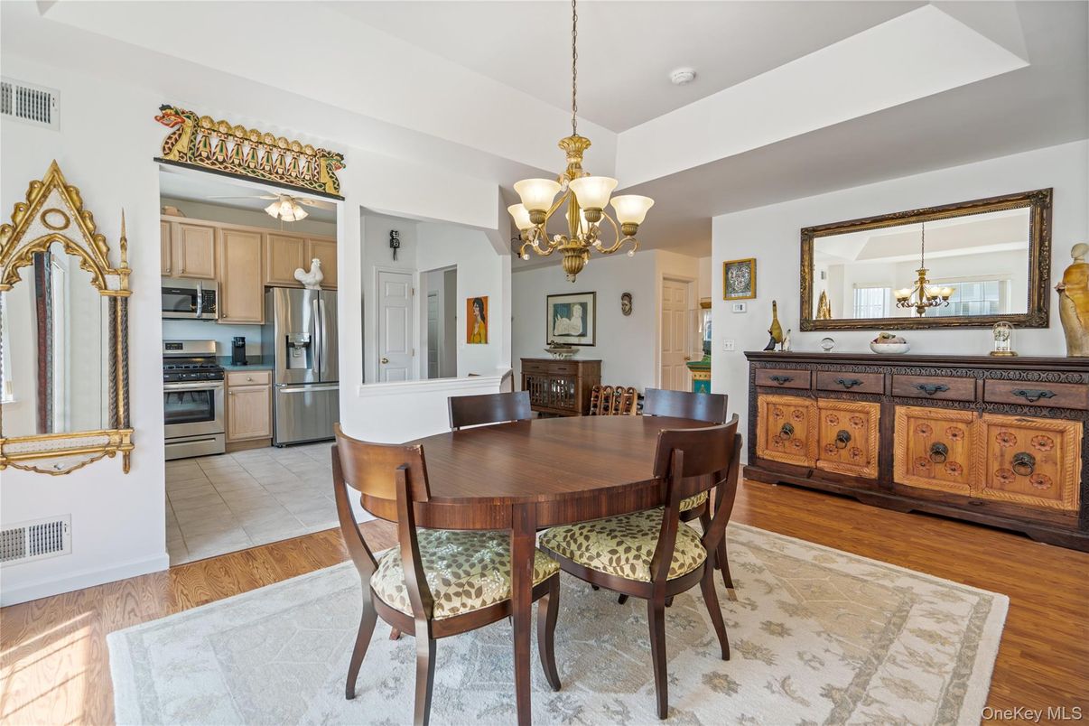 Chandelier, Dining room, Interior, Kitchen, Pendant Lights, Stainless Steel Appliances, Wood Texture Flooring