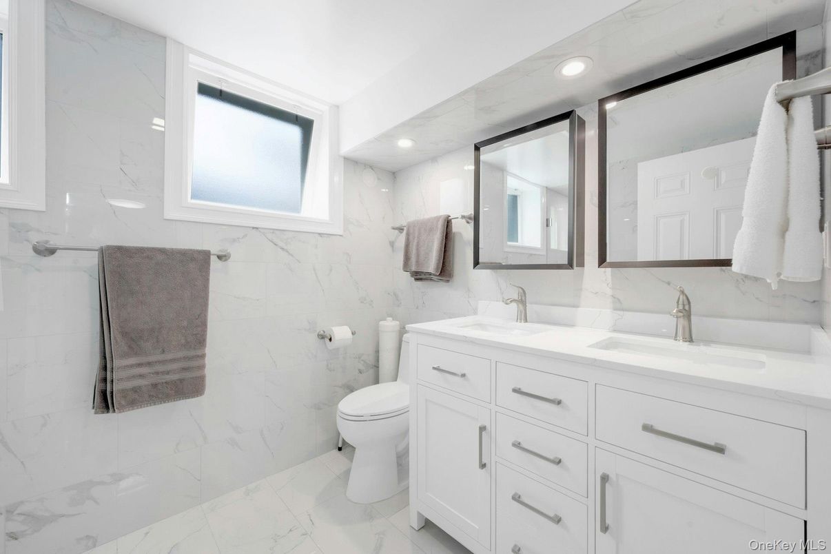 Bathroom, Dual Sink Vanities, Interior, Marble, Marble Walls, Recessed Lighting