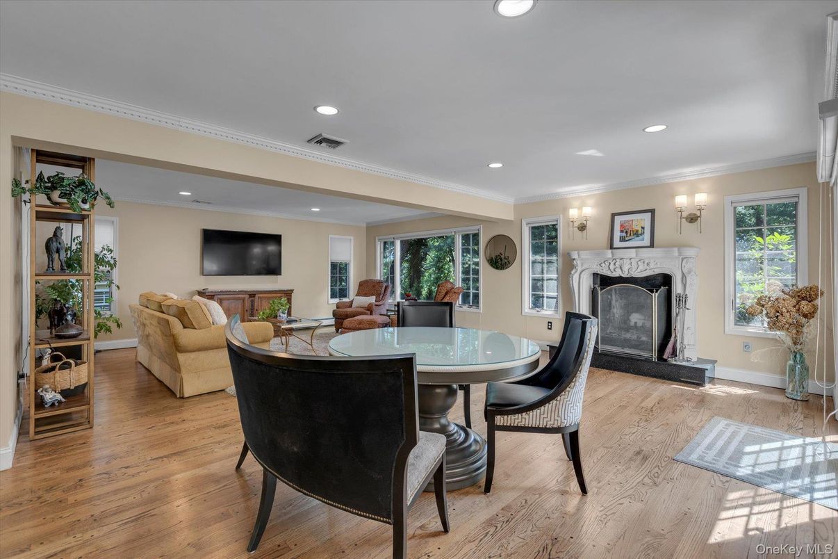 Dining room, Fireplace, Interior, Living room, Recessed Lighting, Wood Texture Flooring
