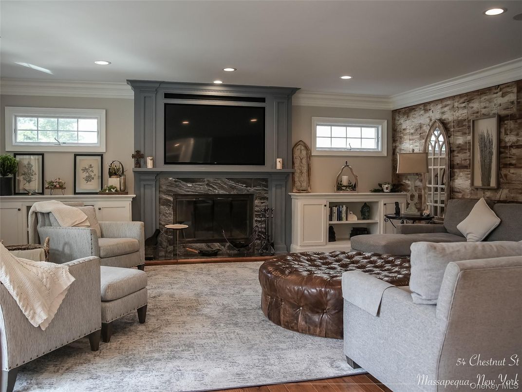 Fireplace, Interior, Living room, Recessed Lighting, Stone Walls, Wood Texture Flooring