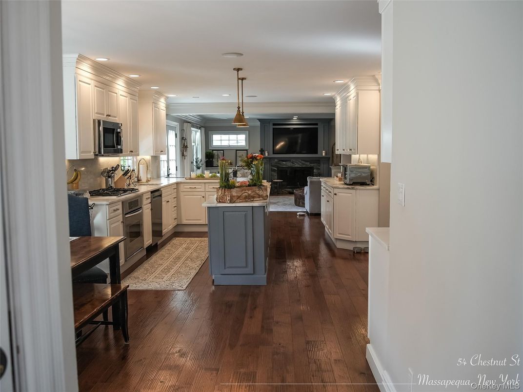 Fireplace, Interior, Kitchen, Living room, Pendant Lights, Recessed Lighting, Stainless Steel Appliances, Wood Texture Flooring