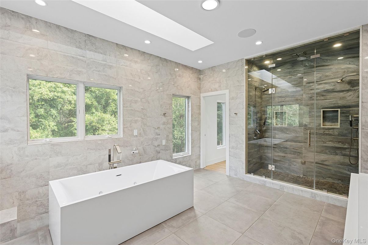 Bathroom, Free Standing Baths, Glass Shower, Interior, Marble Walls, Recessed Lighting