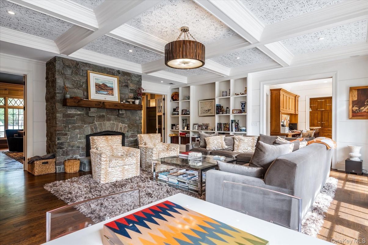Fireplace, Interior, Living room, Recessed Lighting, Stone Walls, Wood Texture Flooring